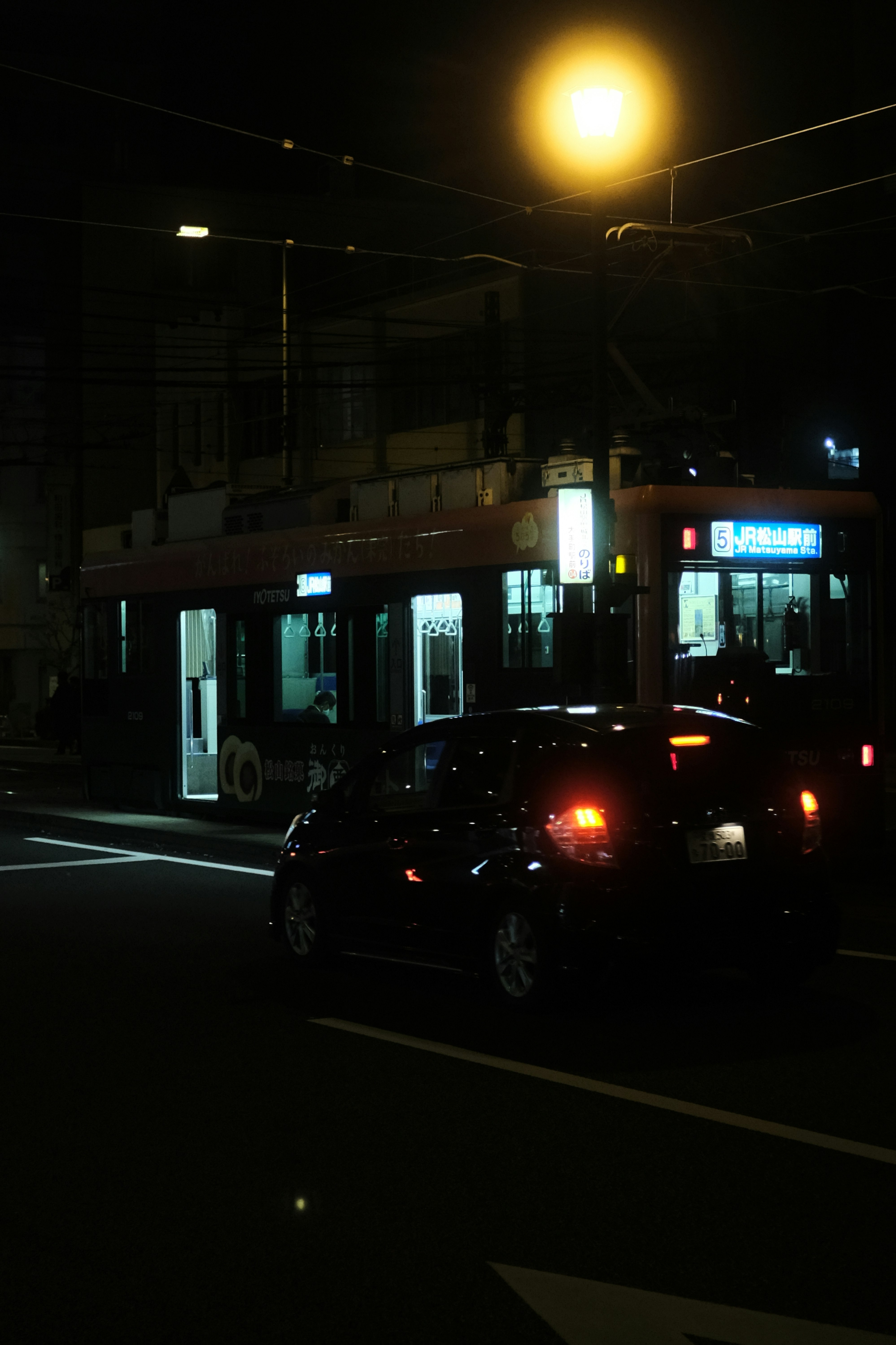 black sedan on road during night time